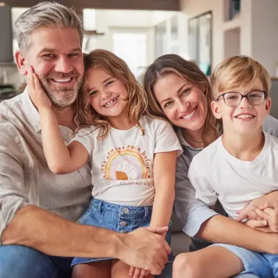 family relaxing laughing in home